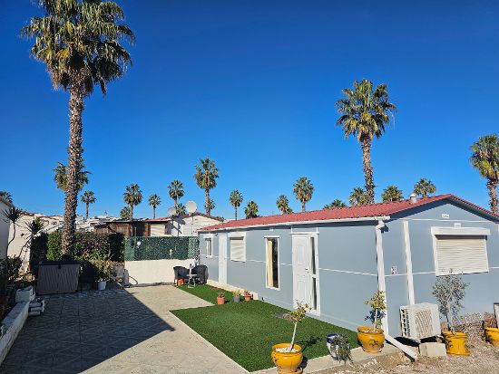 Outside of the mobile home : 3 bed, 1 bath mobile home for sale in Las Mimosas